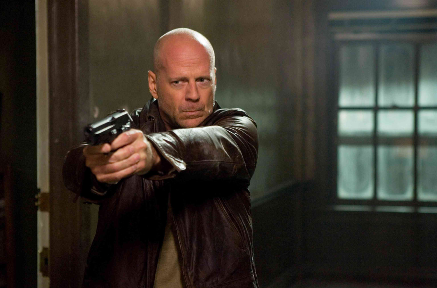Bruce Willis as John McClane takes aim in LIVE FREE OR DIE HARD.